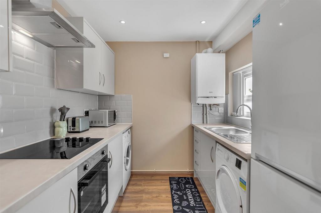 Bright fitted galley kitchen with modern units...