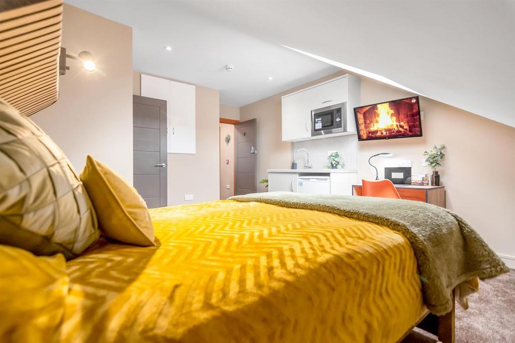 Bright, modern bedroom with warm decor...