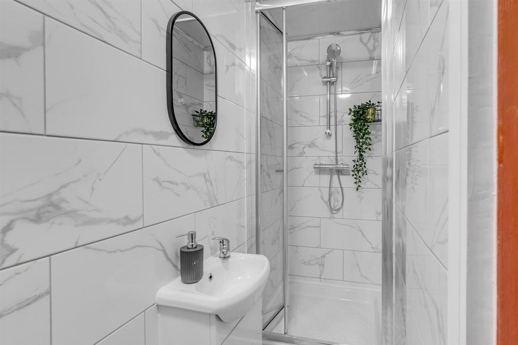 Modern tiled shower room with sleek fittings...