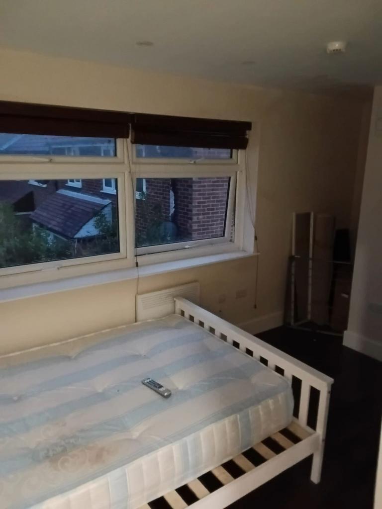 Bright double bedroom with large windows...