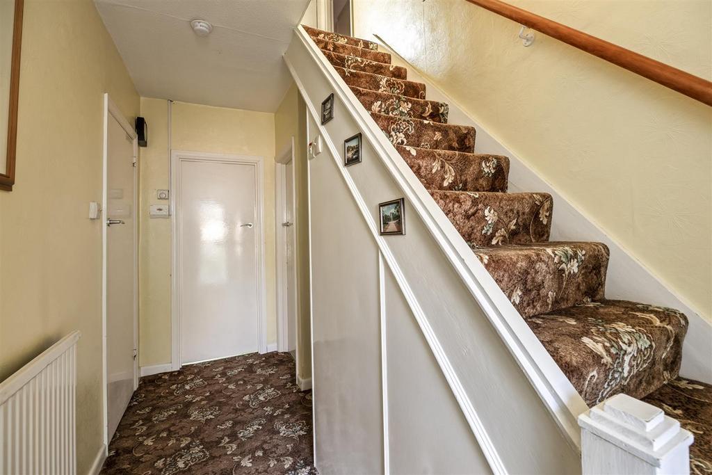 Stairs rising to First Floor