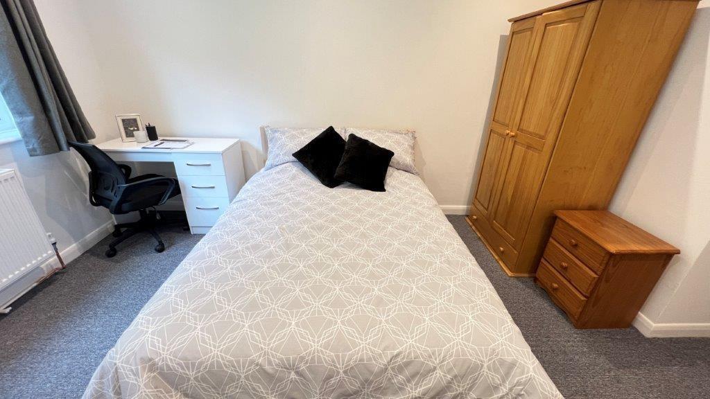 Bright bedroom with double bed and study area...