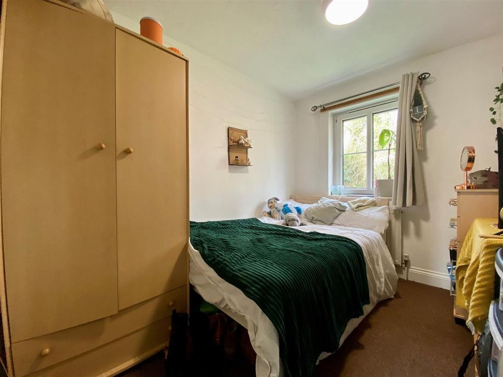 Cozy bedroom with double bed and wardrobe...