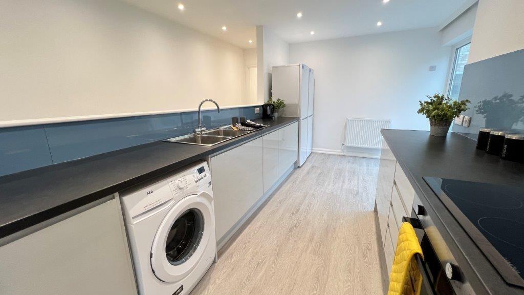 Modern galley kitchen with sleek worktops...