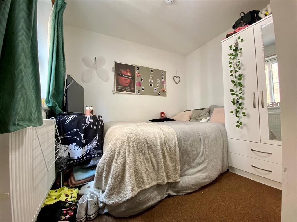 Cozy double bedroom with wardrobe and naturalli...