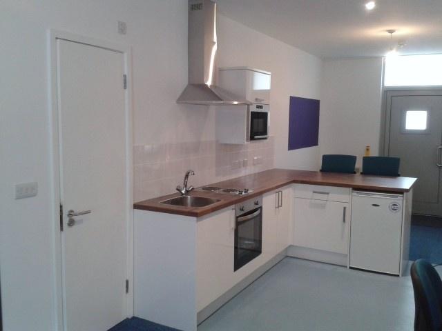 Modern kitchenette with breakfast bar seating...