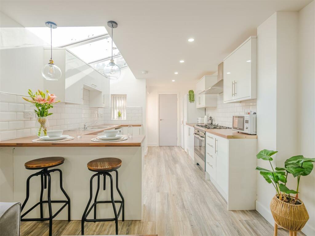 Bright modern kitchen with breakfast bar...