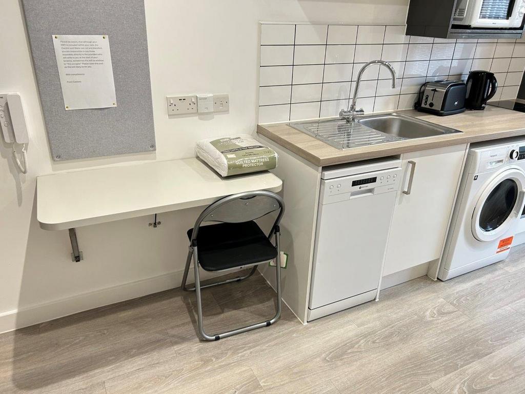 Neat kitchenette with fold-down study desk...
