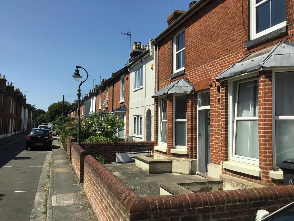 Sunny street-facing terraced homes with front f...