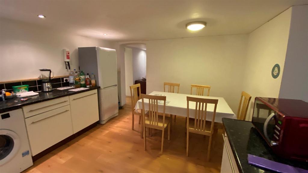Bright open-plan kitchen with dining table...
