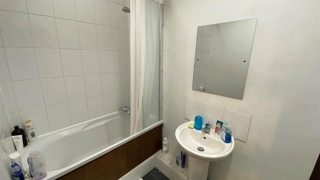 Simple bathroom with bath and basin, clean and ...