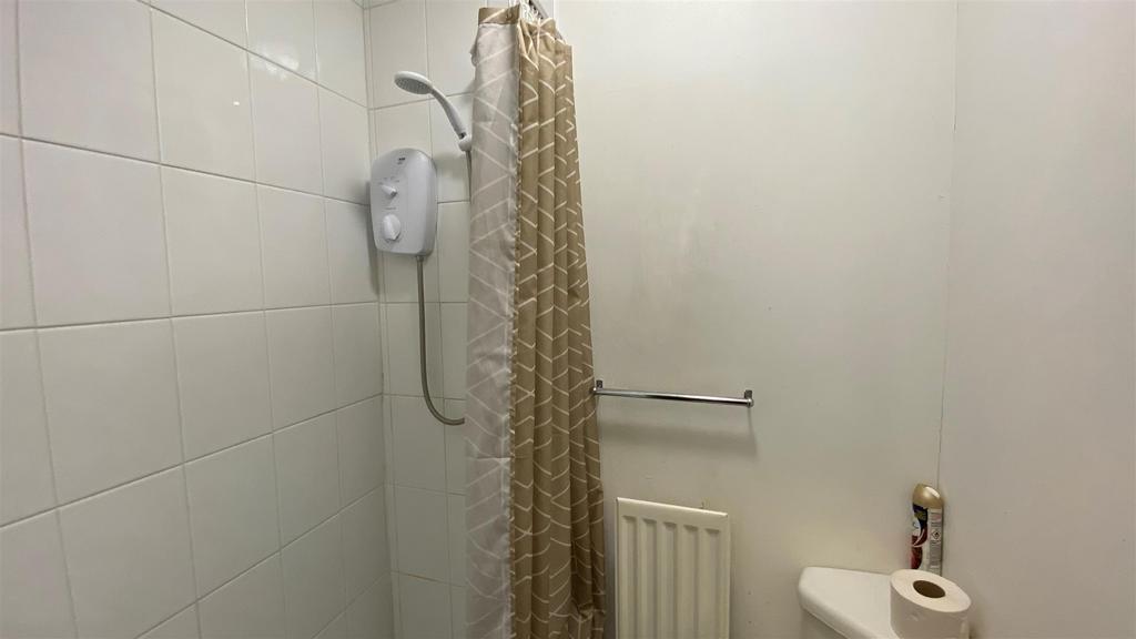Simple bathroom with shower and fitted radiator...