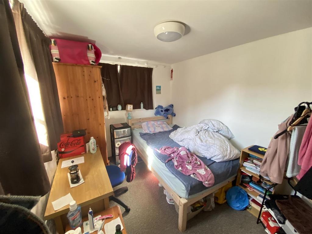 Bright single room with desk and storage...