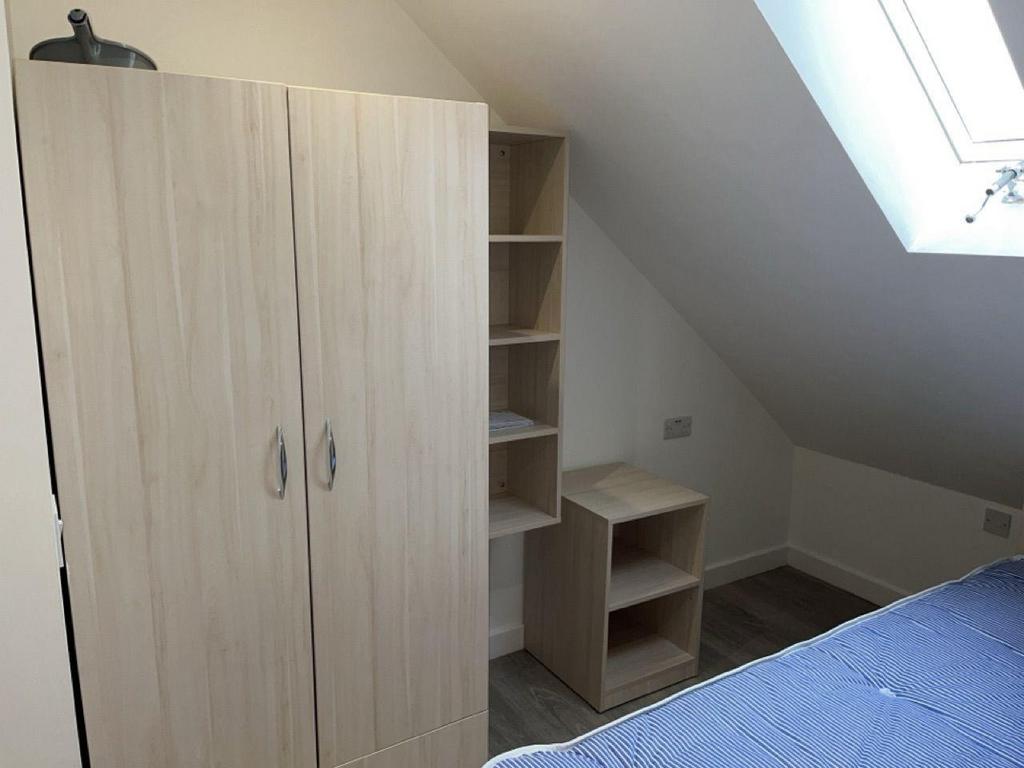 Bright attic bedroom with built-in storage...
