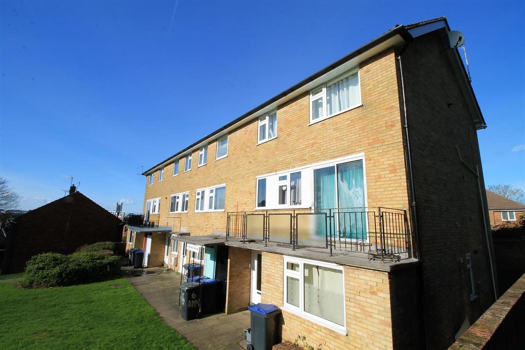 Well-lit exterior with front lawn and balcony...