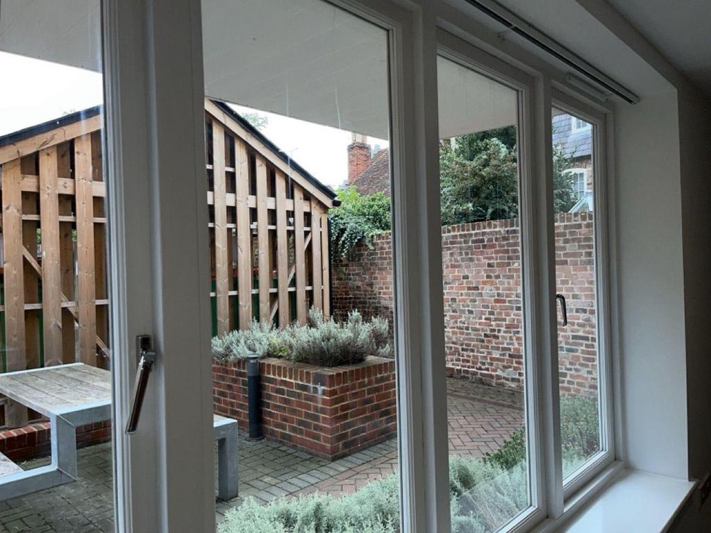 Private paved courtyard with raised planters...