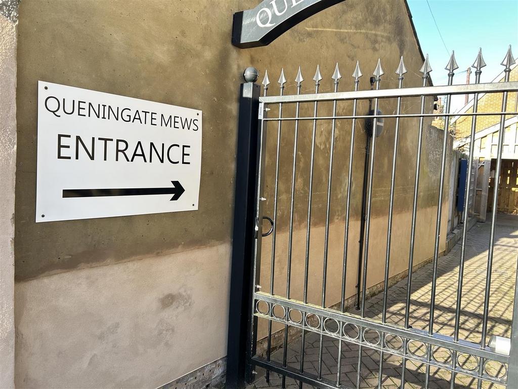 Gated entrance with clear directional signage...