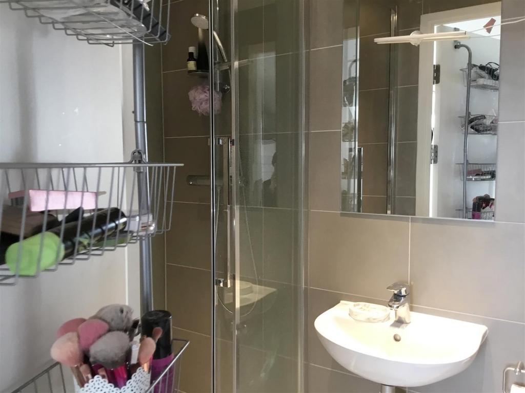 Bright modern bathroom with shower and basin...