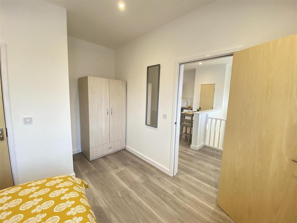 Bright double bedroom with wardrobe and wood fl...