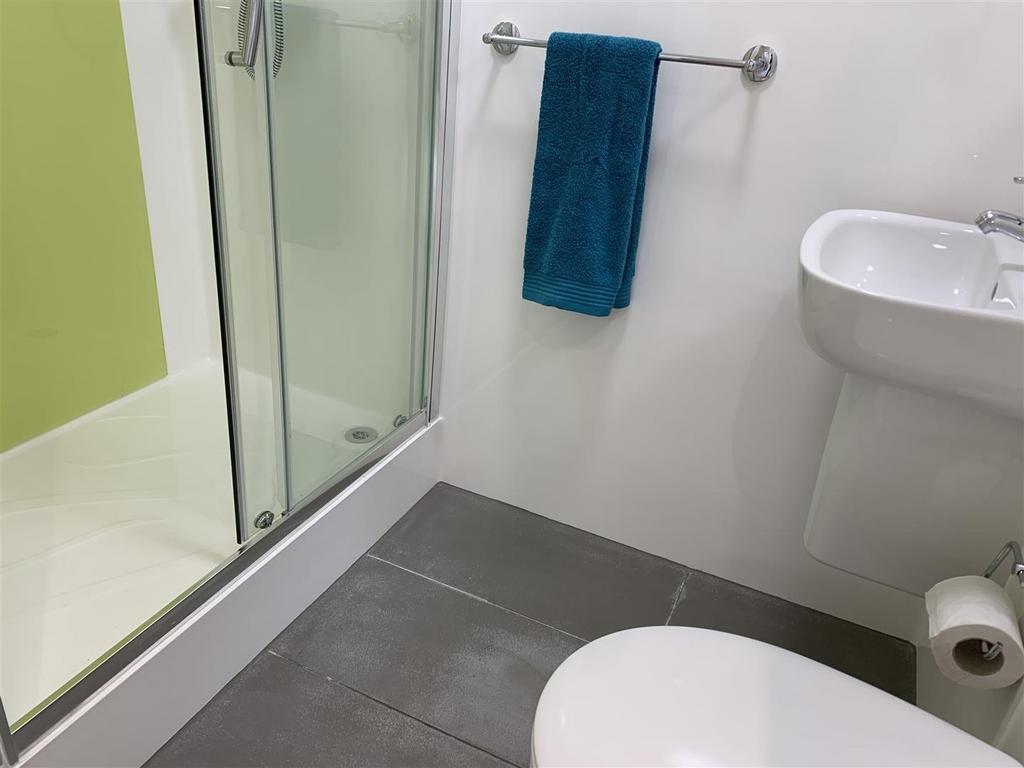 Fresh modern bathroom with walk-in shower...