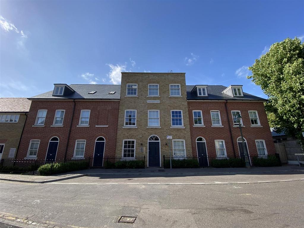 Attractive townhouse frontage with clear blue s...
