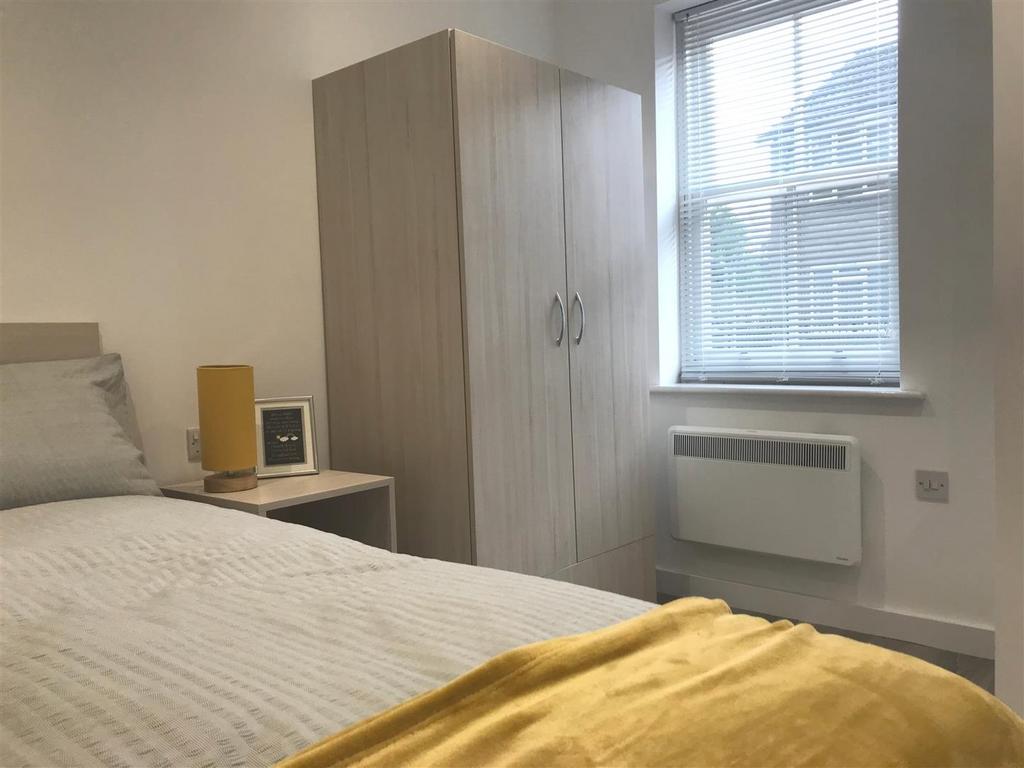 Bright bedroom with wardrobe and comfy bed...