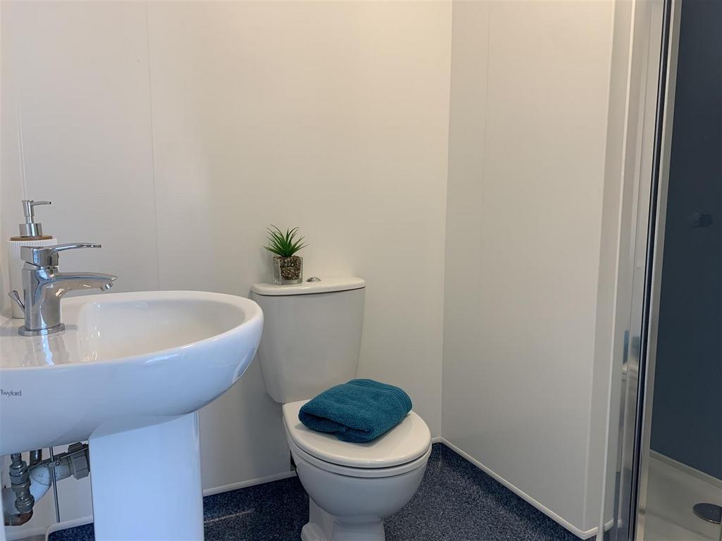 Clean compact bathroom with modern fixtures...