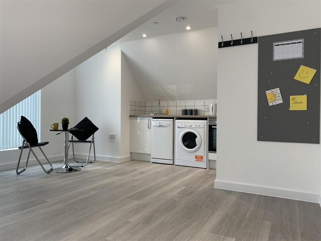 Bright open-plan kitchen with modern flooring...