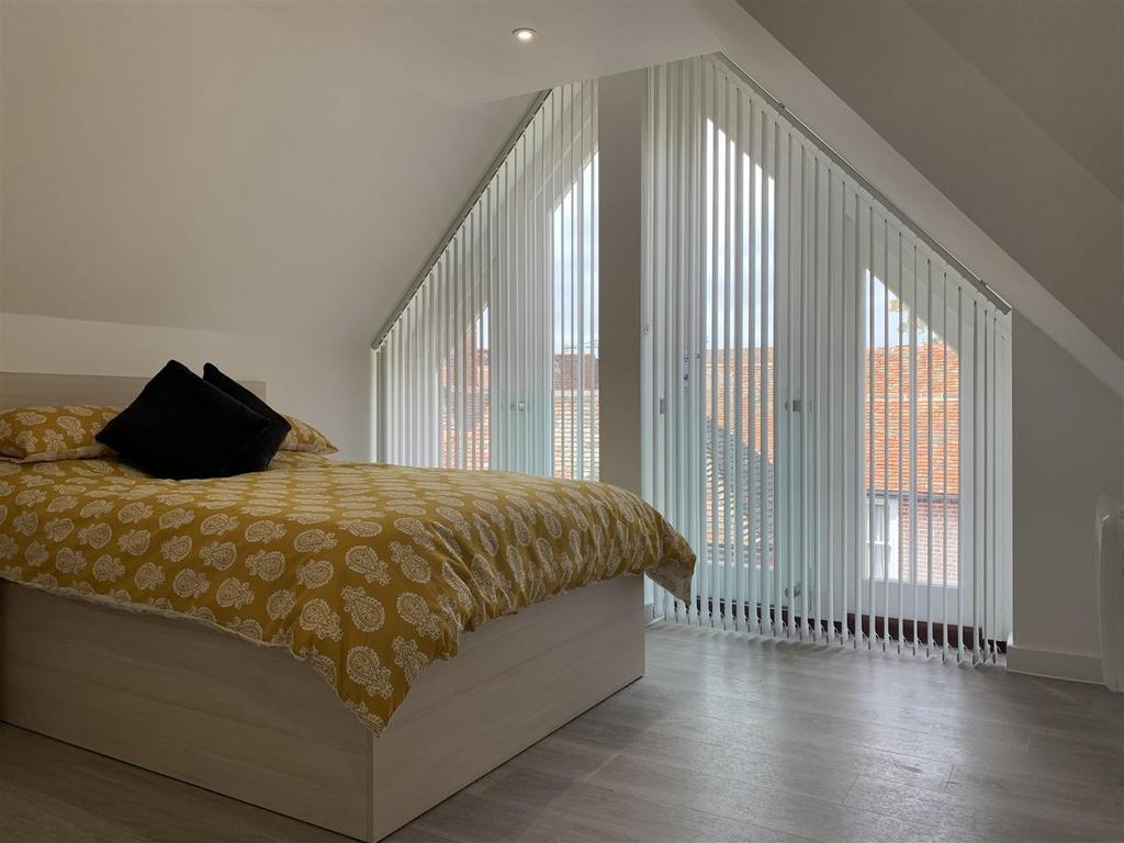Bright attic double bedroom with large glazed g...