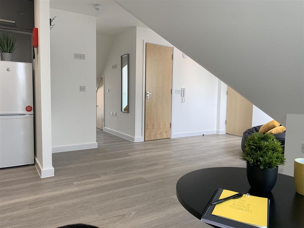 Bright open plan lounge with modern flooring...