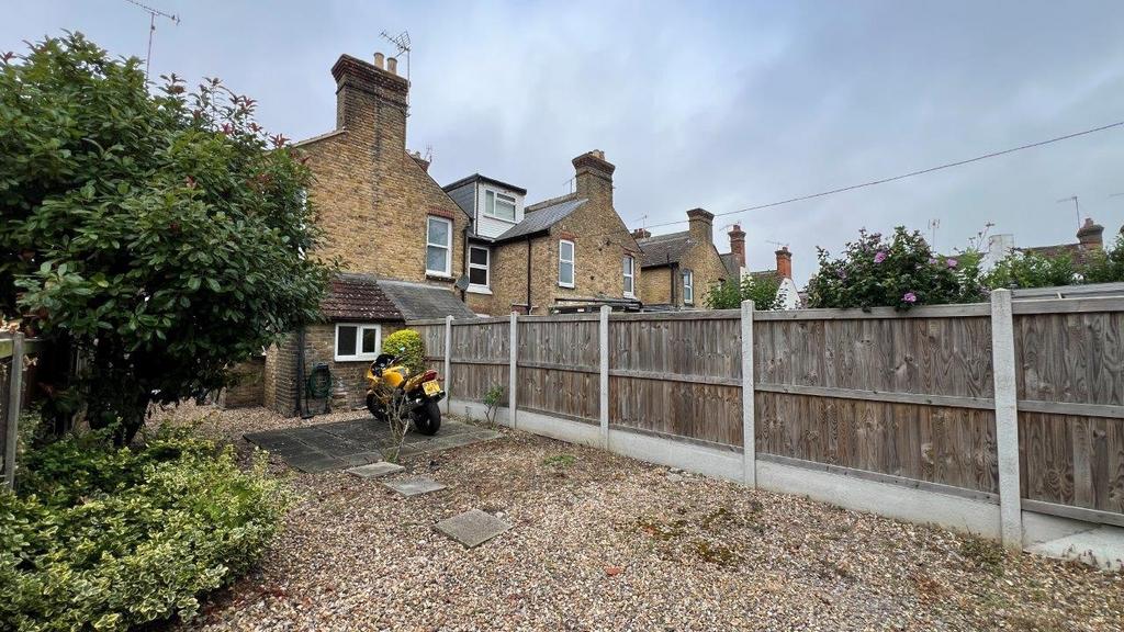 Low-maintenance private rear garden with patio ...