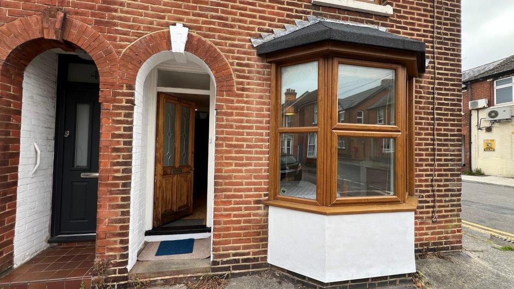 Well-kept brick front with bay window and porch...