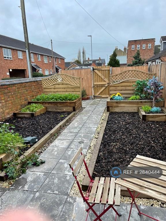 Garden With Private Parking Spaces Beyond