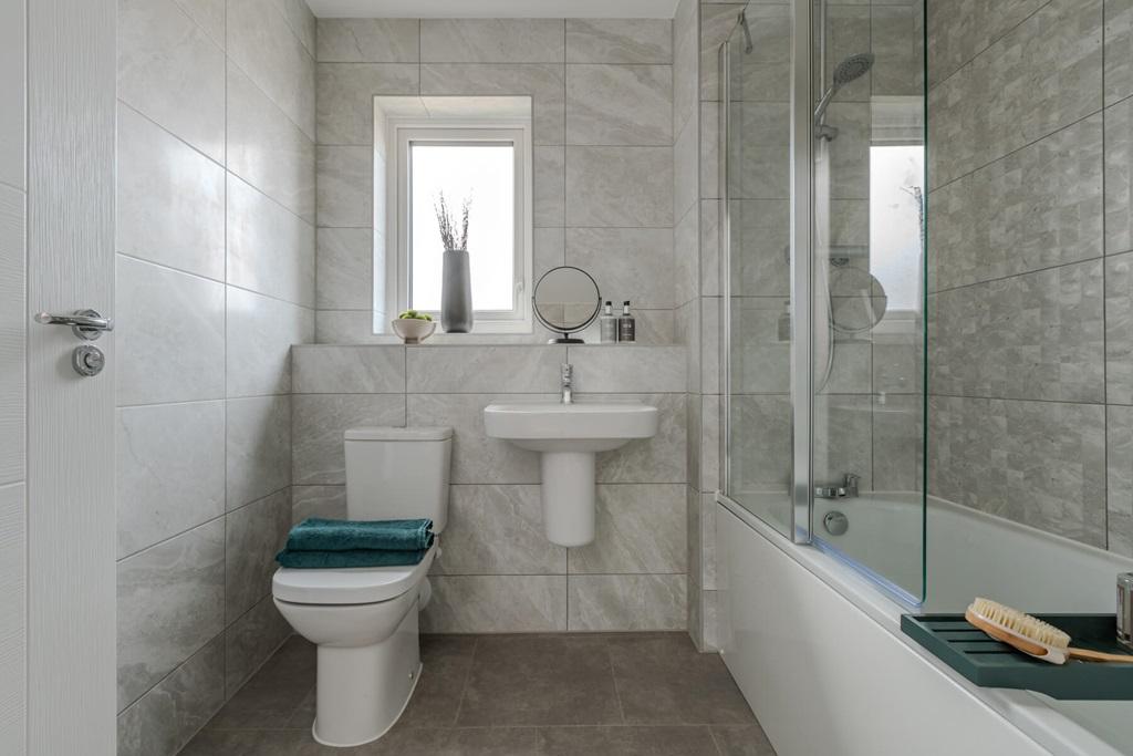 A simple, harmonious bathroom designed to make...