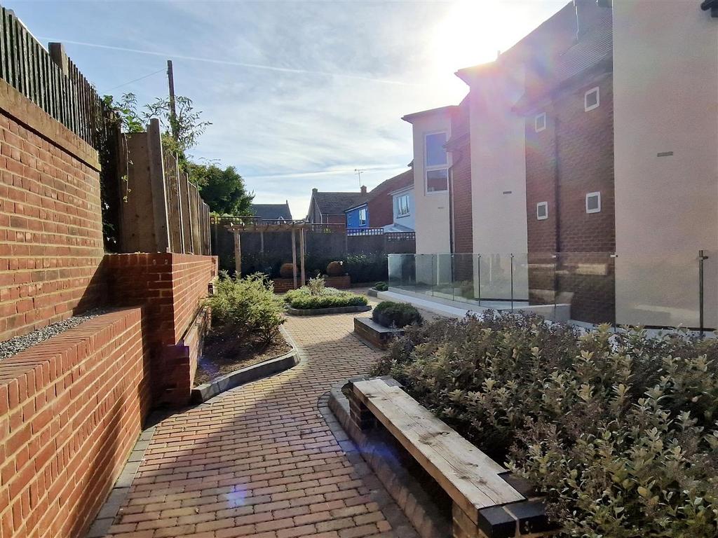 Bright and sunny landscaped courtyard garden...