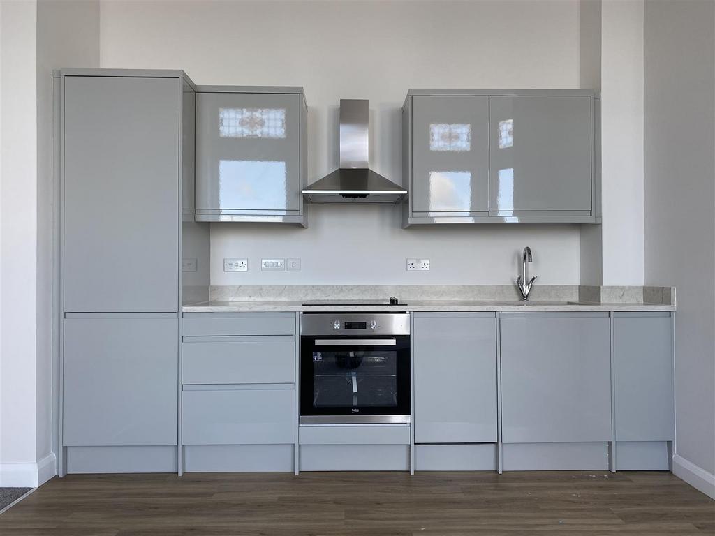 Modern sleek kitchen with high-gloss cabinetry...