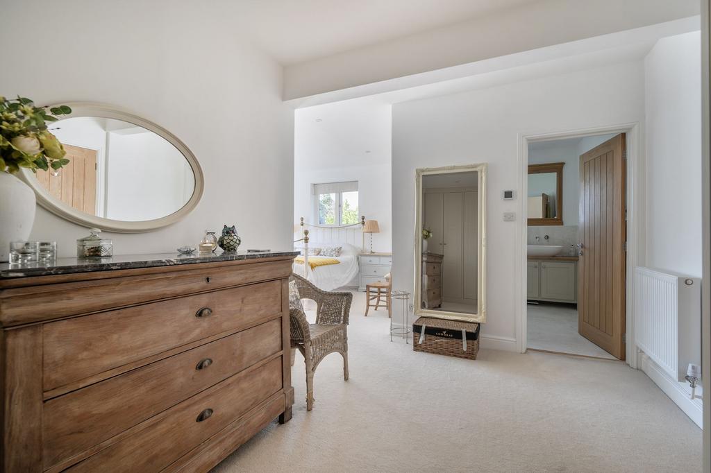 Principal bedroom suite with dressing area