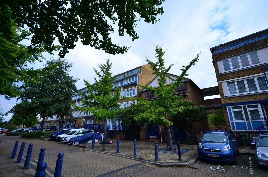 Street scene with property, parking