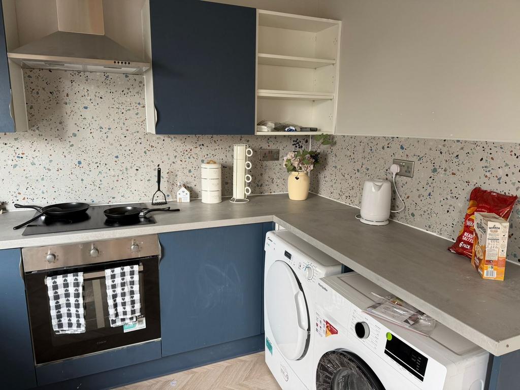 Modern kitchen with stylish terrazzo splashback...