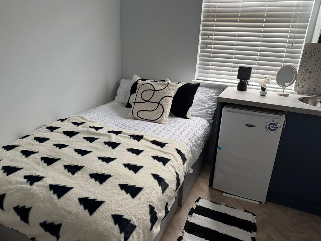 Bright modern bedroom with stylish furnishings...