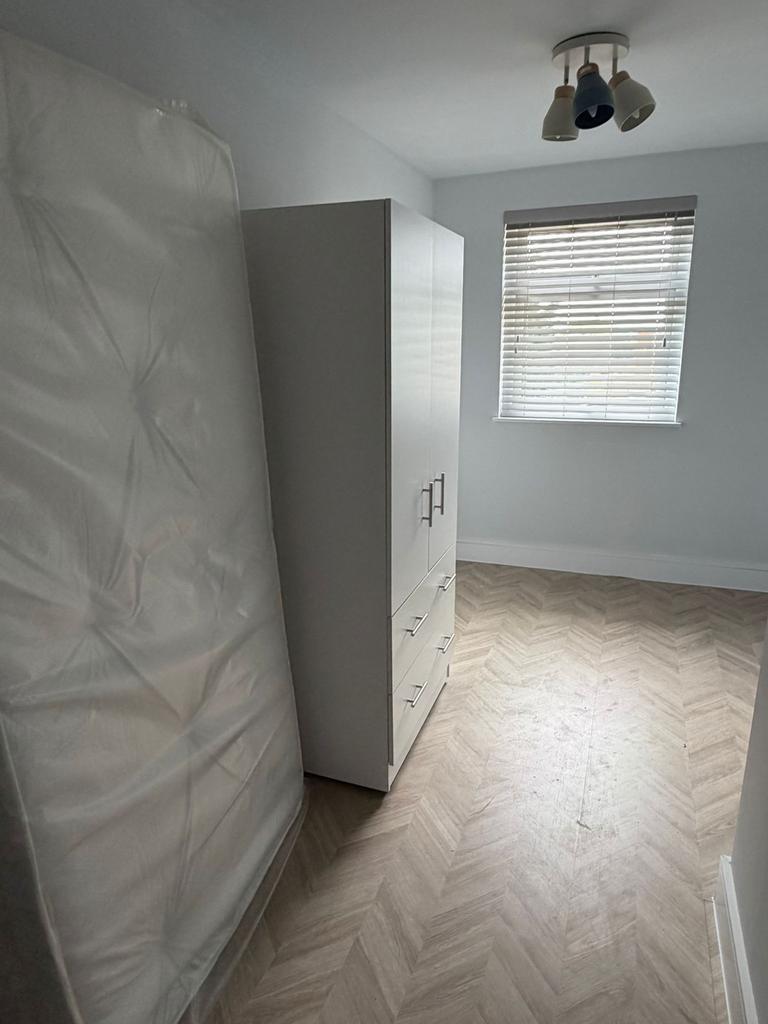 Bright modern room with stylish wood floor...