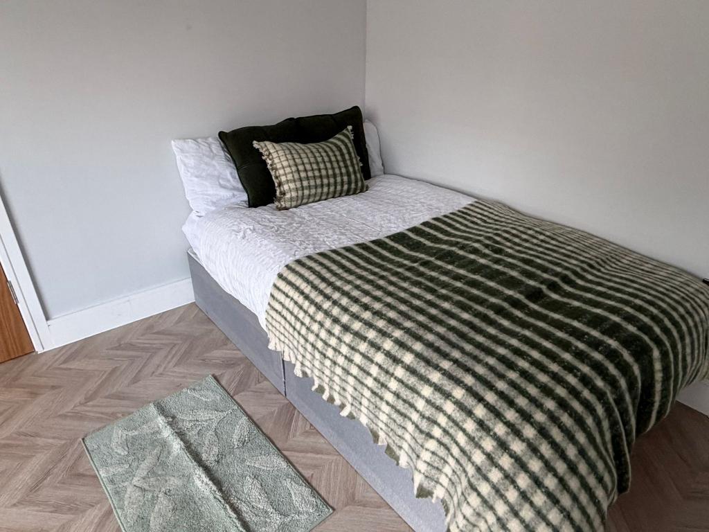 Cosy modern bedroom with stylish parquet floori...