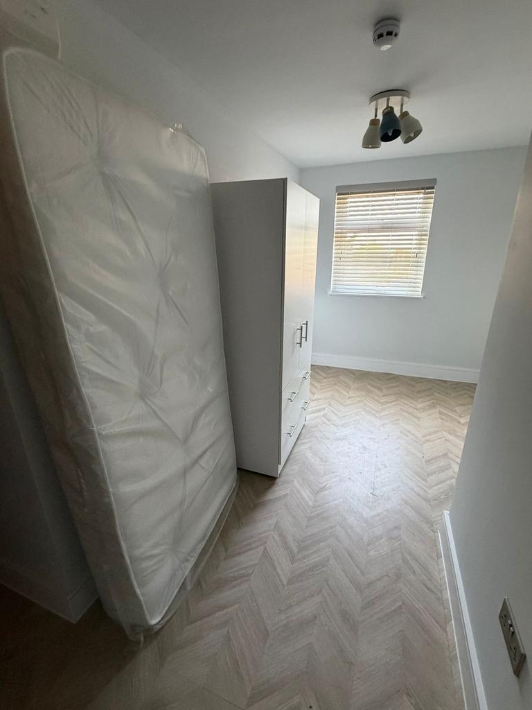 Modern room with bright herringbone flooring...