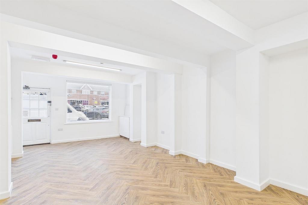 Bright spacious room with stylish wood flooring...