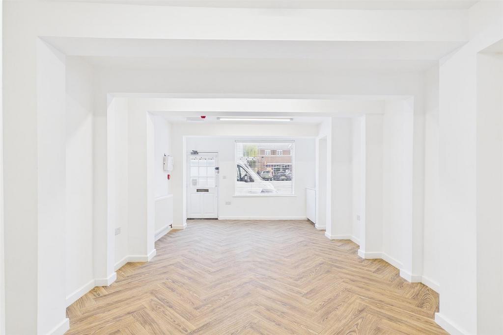 Bright, airy space with stylish wood flooring....
