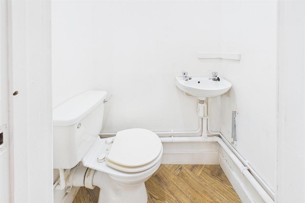 Bright and clean cloakroom with wooden floor...