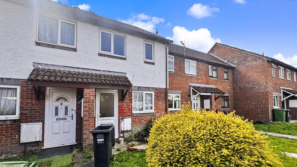 Charming terraced house with bright blue skies...