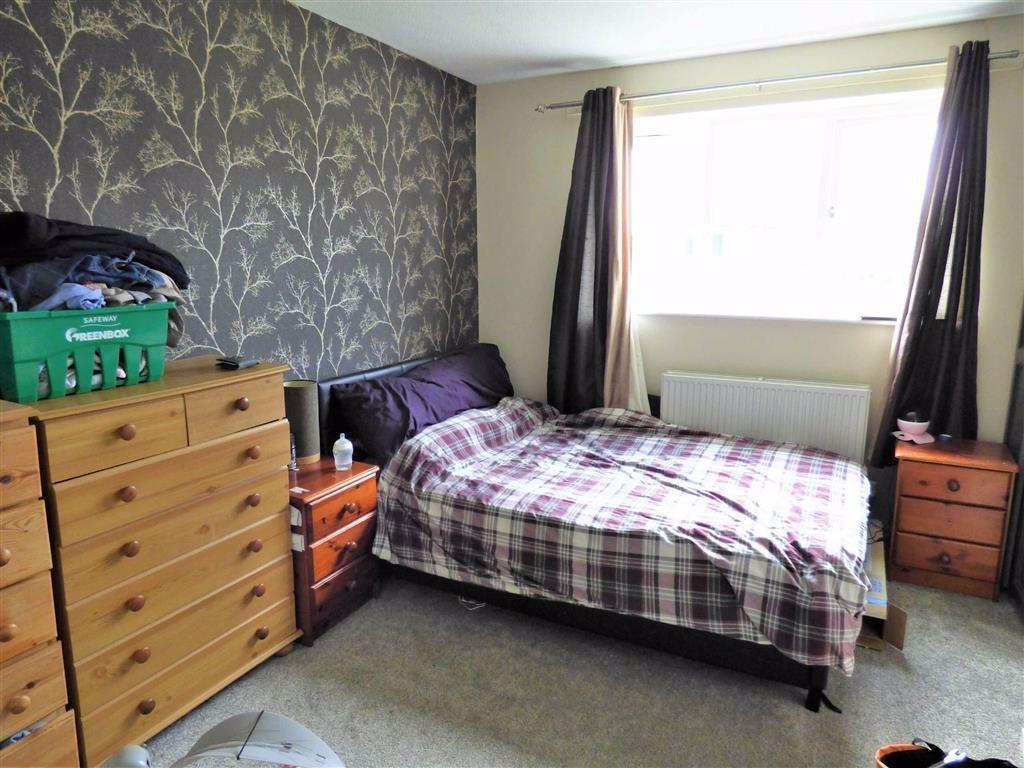 Bright double bedroom with stylish feature wall...