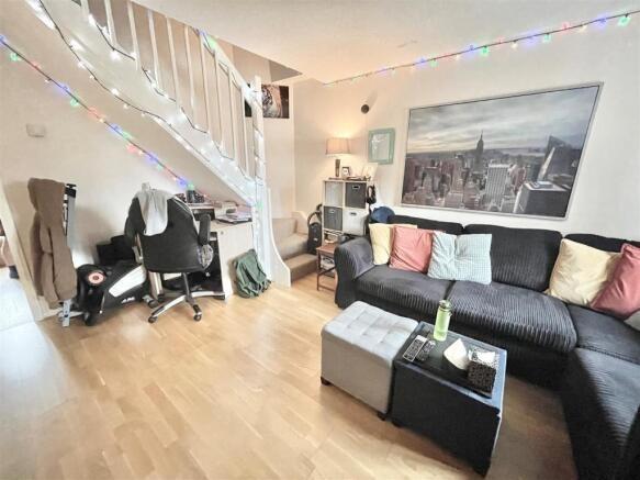 Bright, modern living area with a comfortable b...