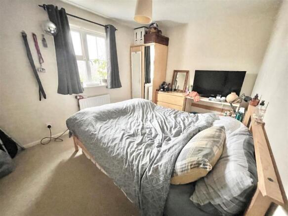 Bright bedroom with a large double bed, natural...